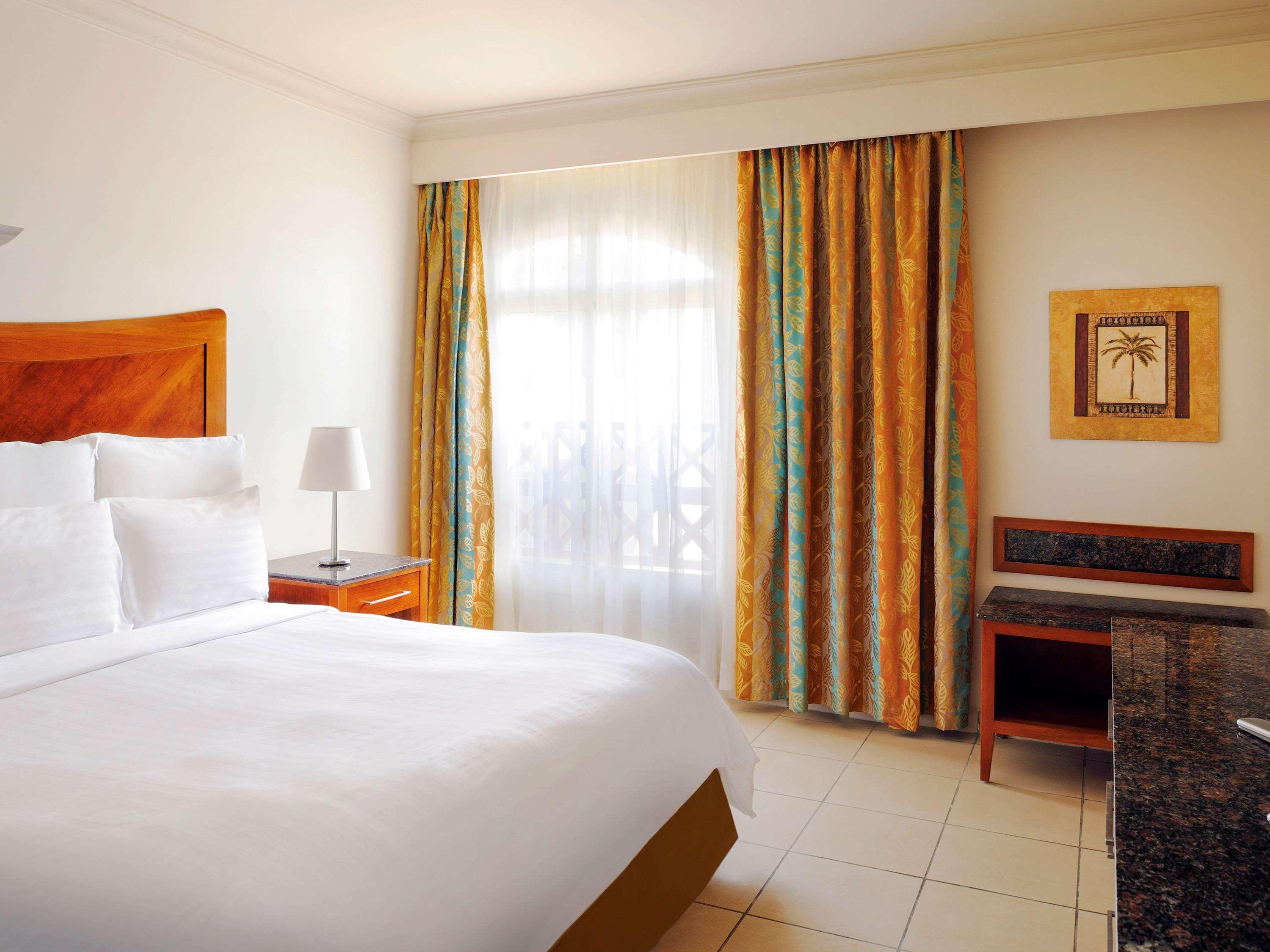 Naama Bay Promenade Beach Resort Managed By Accor Sharm el-Sheikh Exterior photo A bedroom at the Westin Awantisu Hotel